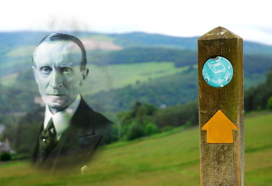 View of John Buchan Way sign post with hills in the background